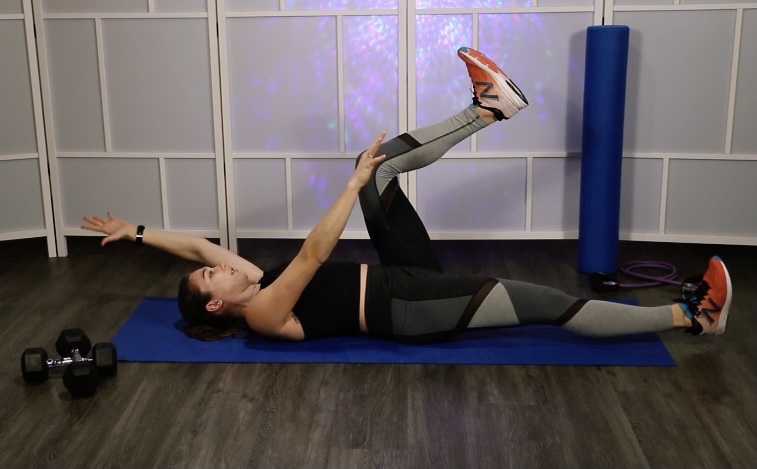 Instructor exercising on mat